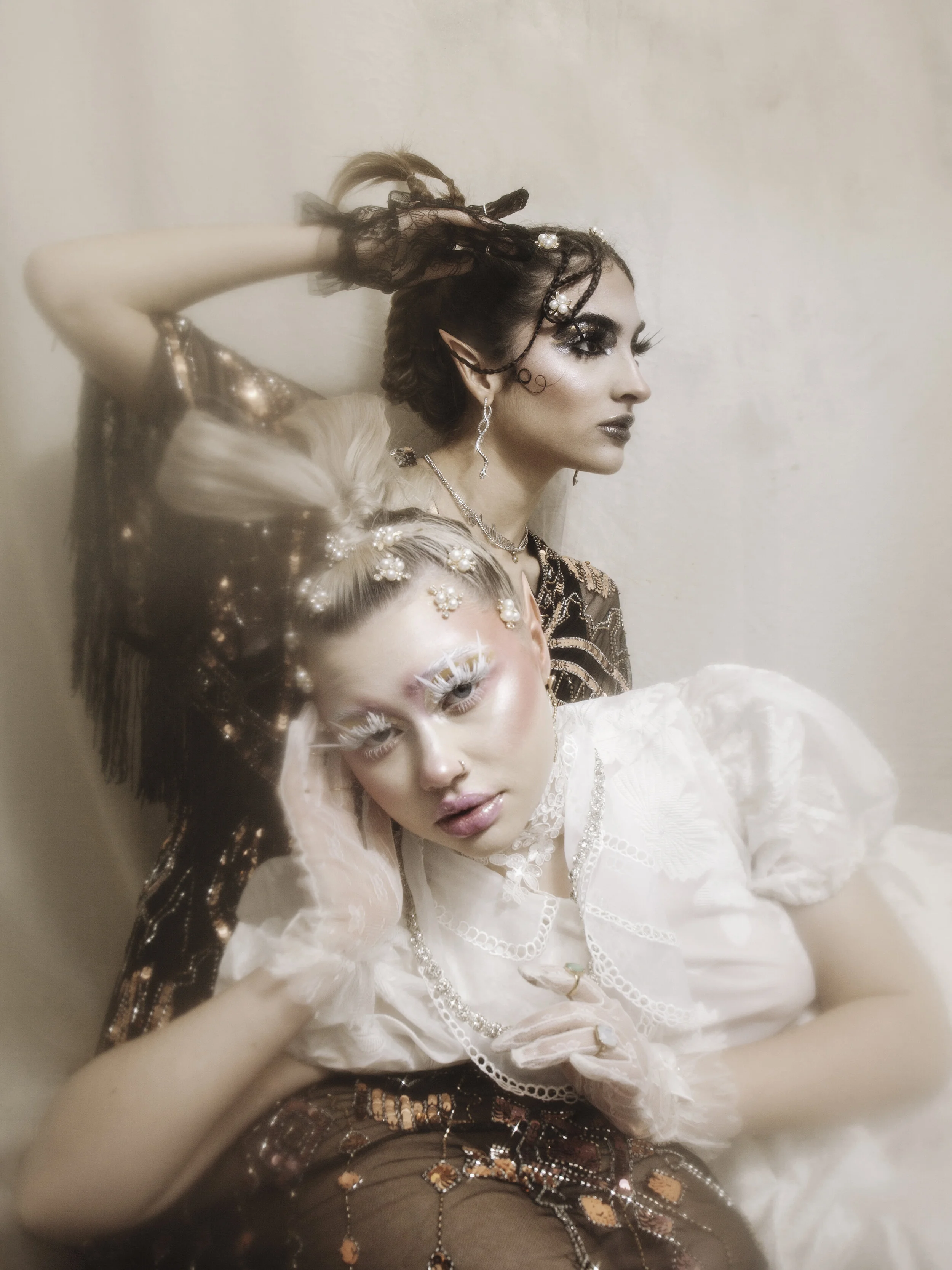 Photographer: Clara Barroso Model: Eleri Evans Female Model: Beatriz Saramago Makeup Artist: Zoe Philippa Efthymiadou Assistant: Georgia Sears Wardrobe Credits: Silver Earrings-ASOS Black Long Sequin Dress-ASOS Black Lace Gloves-NastyGa