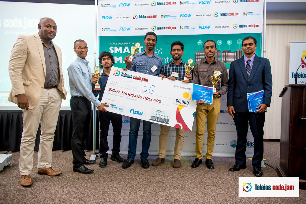 TCJ 2016 WINNERS TEAM 5G DISPLAY THEIR PRIZES ALONG WITH SPONSORS L-R LEARIE ROBERTS (MARKETING MANAGER- MASSY TECHNOLOGIES INFOCOM); RONALD HINDS (CEO- TELEIOS SYSTEMS); ALLAN KANGALOO (PRODUCT MANAGER- FLOW). 