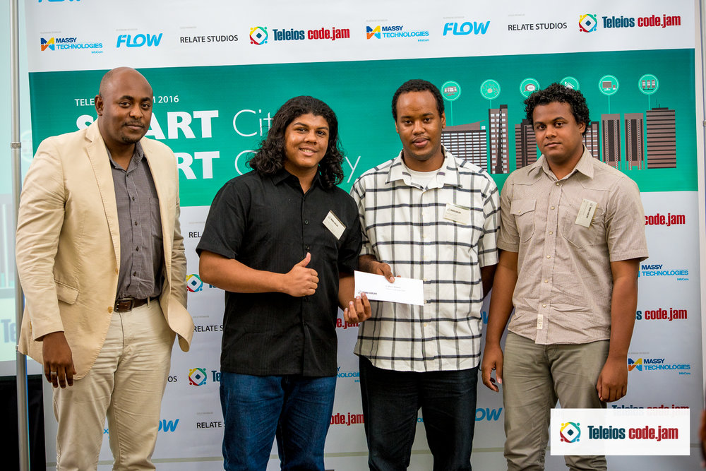 3RD PLACE WINNERS TEAM TG POSE WITH THEIR PRIZE PRESENTED BY LEARIE ROBERTS (MASSY TECHNOLOGIES INFOCOM)
