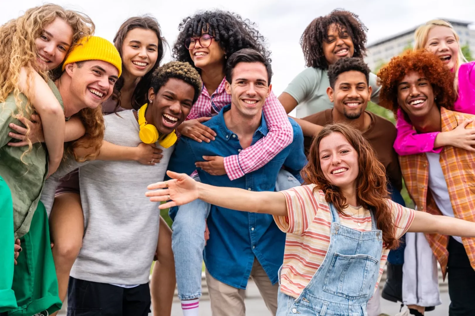 happy-playful-multiethnic-group-of-young-friends-b-2023-11-27-04-57-35-utc-Large.webp