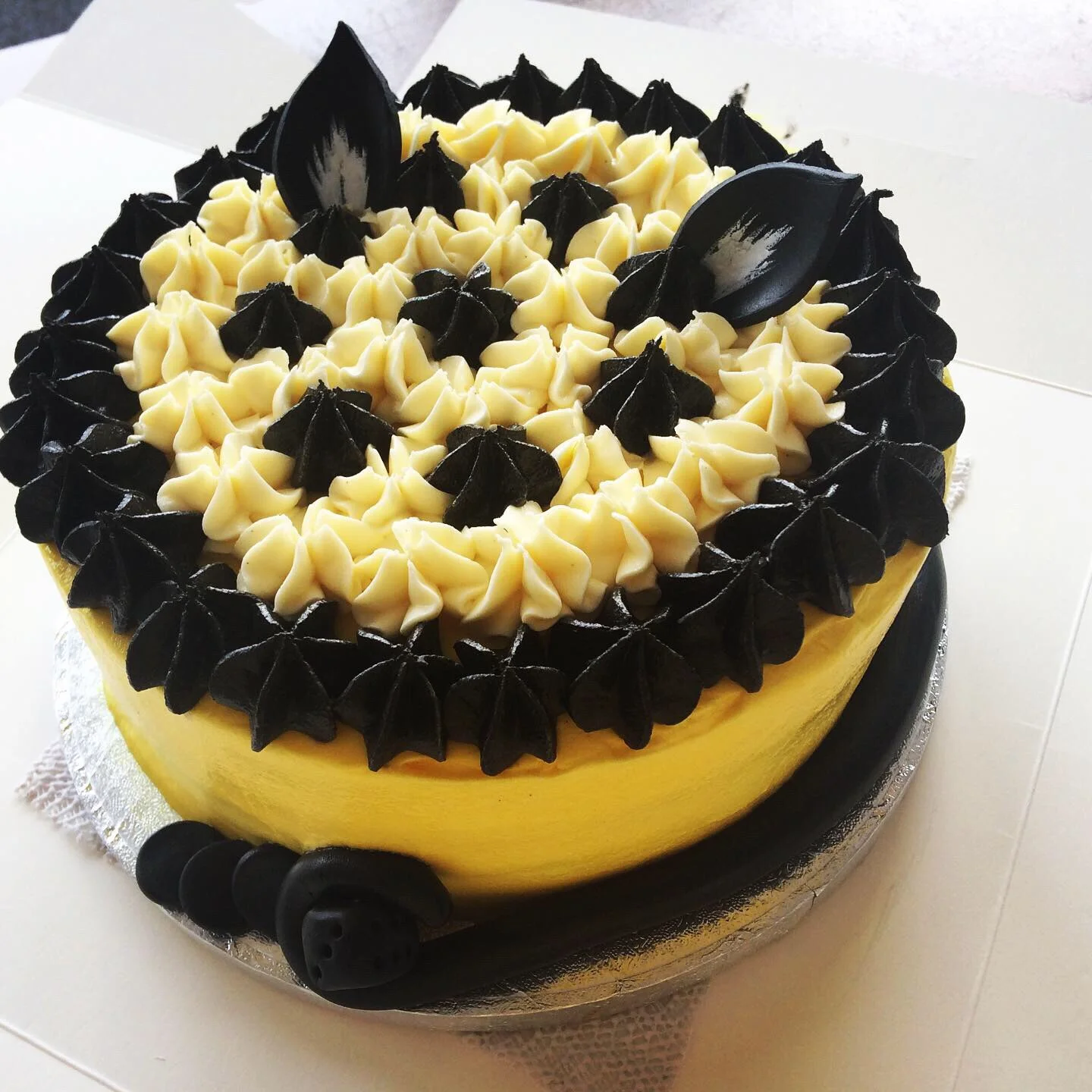 Look at this incredible bright yellow Needy Cat vegan cake provided by Drizzle and Glaze!