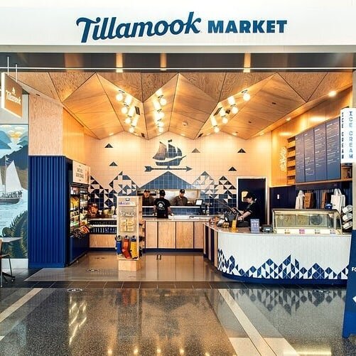 Tillamook opened a brick &amp; mortar location at Portland International Airport in 2020 that made the essence of the beloved coastal creamery brand accessible to jet setters passing through. 

Blend Design Co. consulted, designed, produced and insta