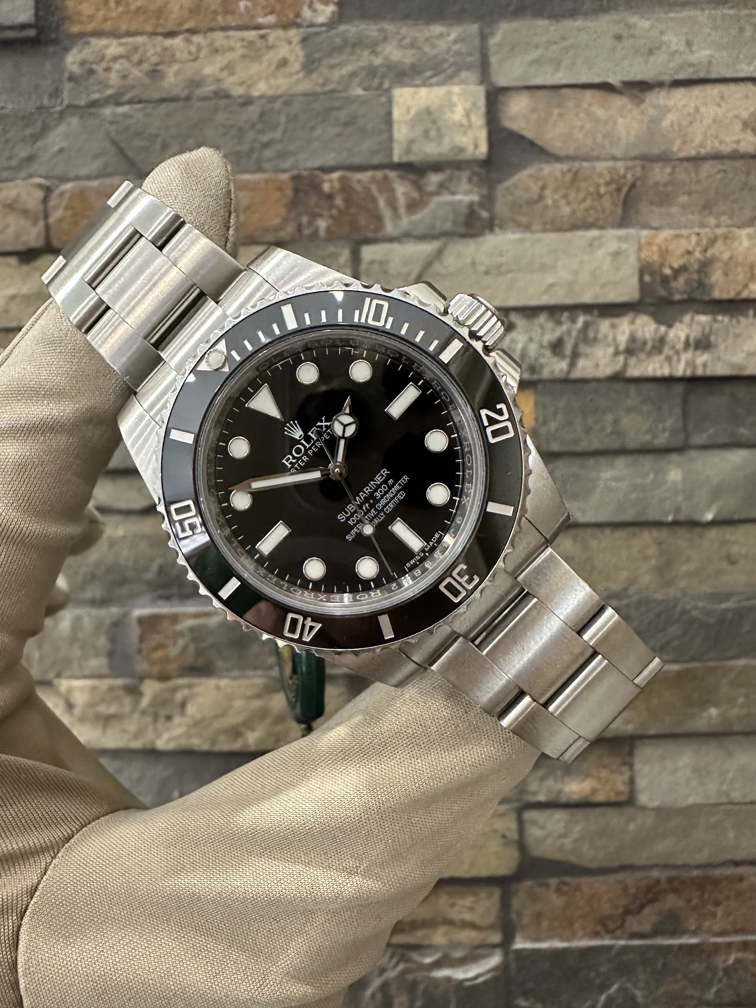 2015 Rolex 40mm No Date Submariner REF #114060 with box and papers. Call or stop by our shop