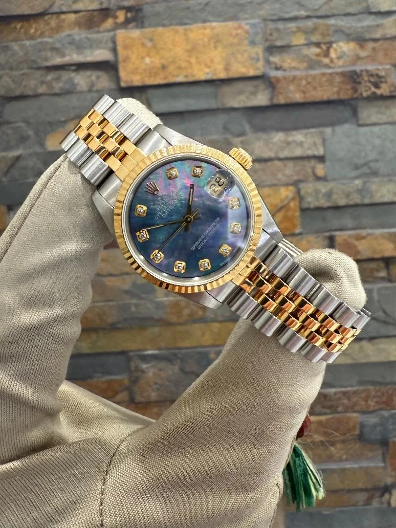 1986 Custom Rolex DJ31 Tahitian MOP REF #68273 with a box. Call or stop by our shop