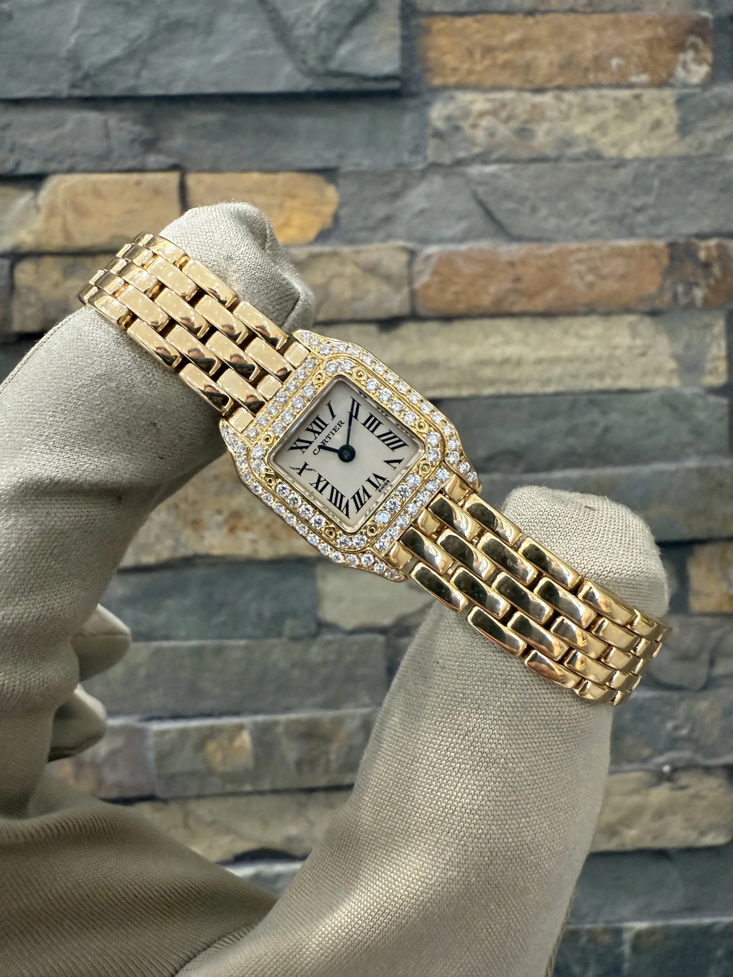 18K Cartier Panthere Mini REF #2360 with box and papers. Call or stop by our shop