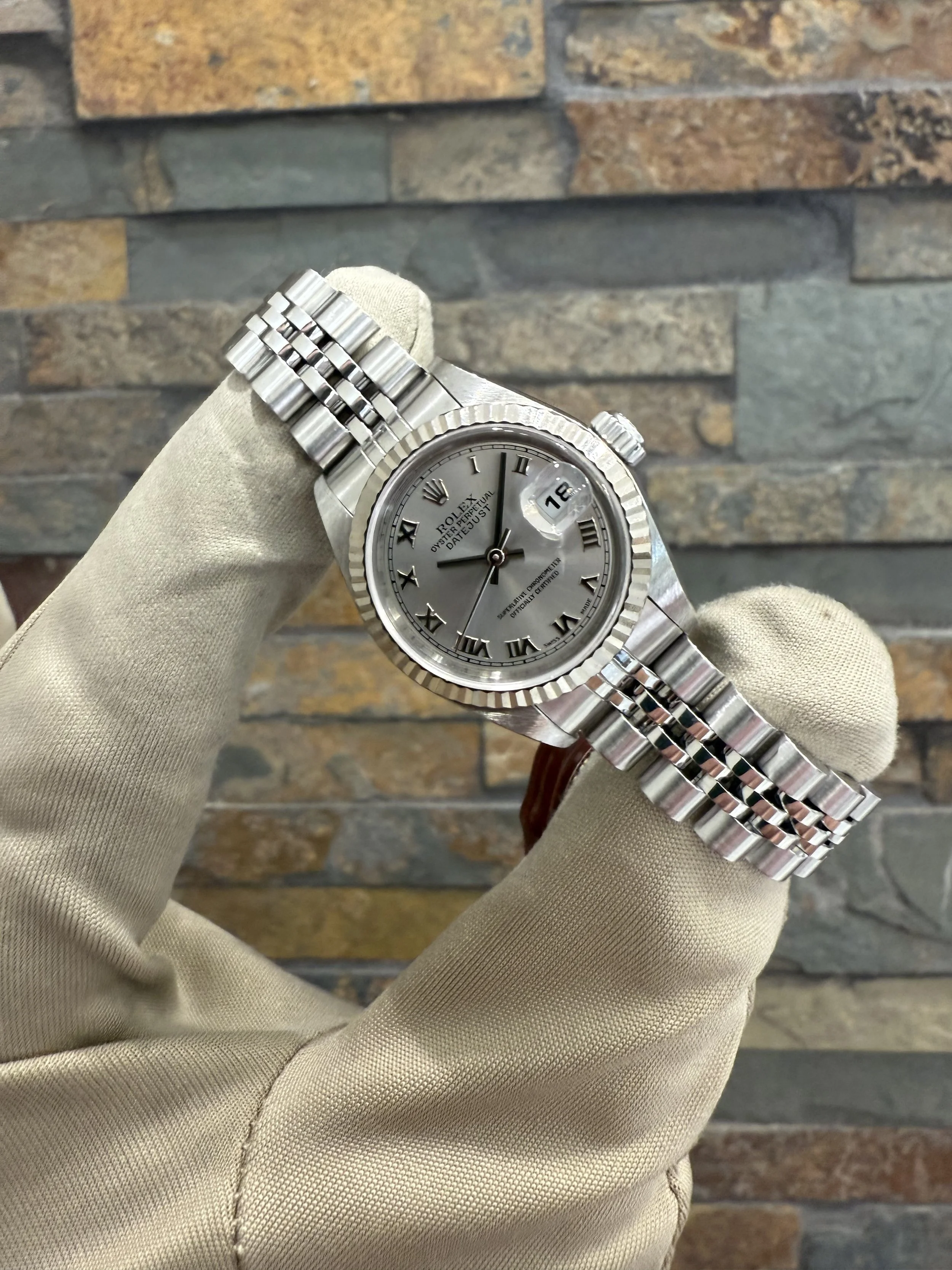 2000 Rolex Datejust 26 REF #79174 with box and papers. Call or stop by our shop