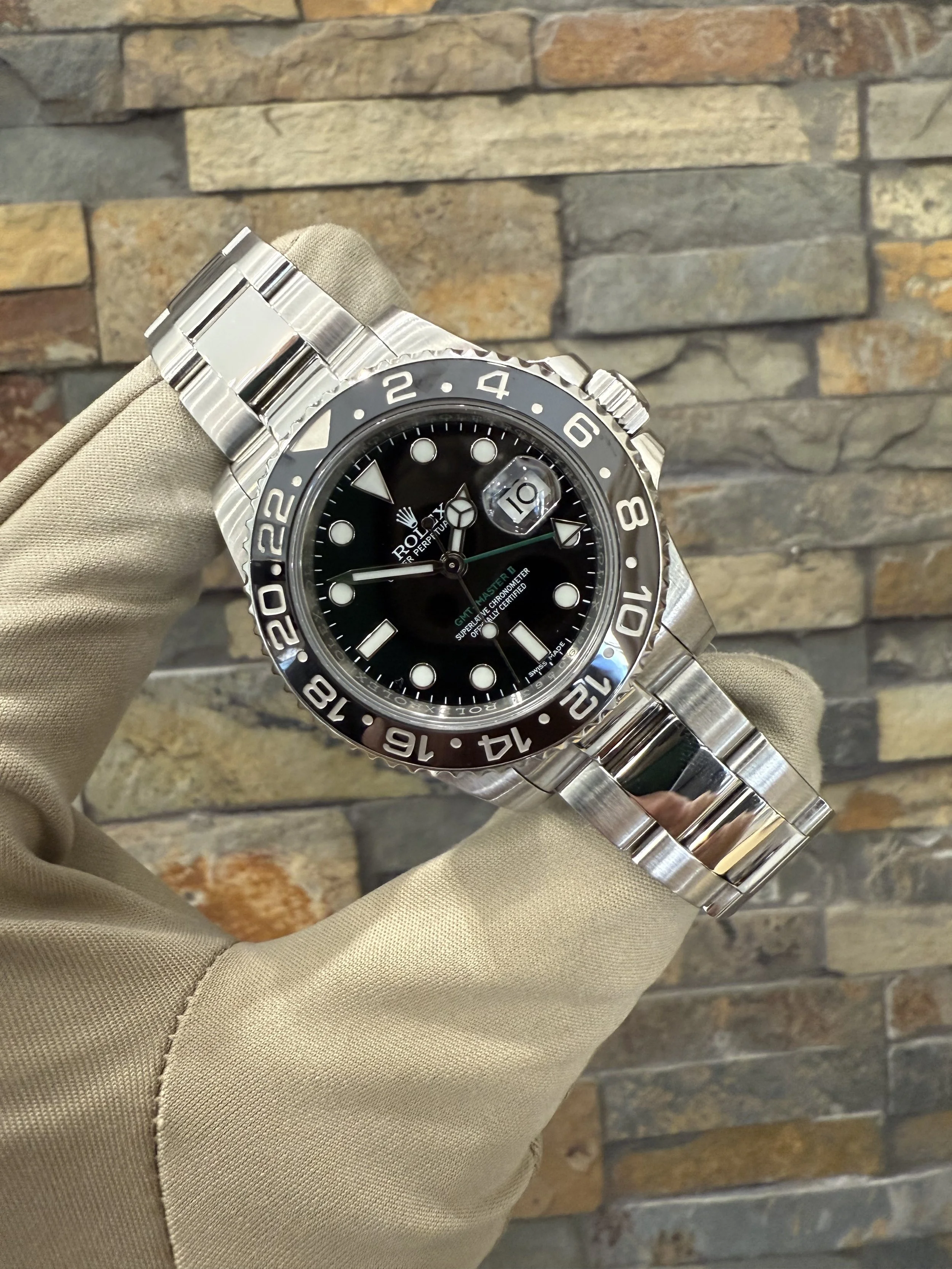 2015 Rolex Green Hand GMT II REF #116710LN with box and papers. Call or stop by our shop