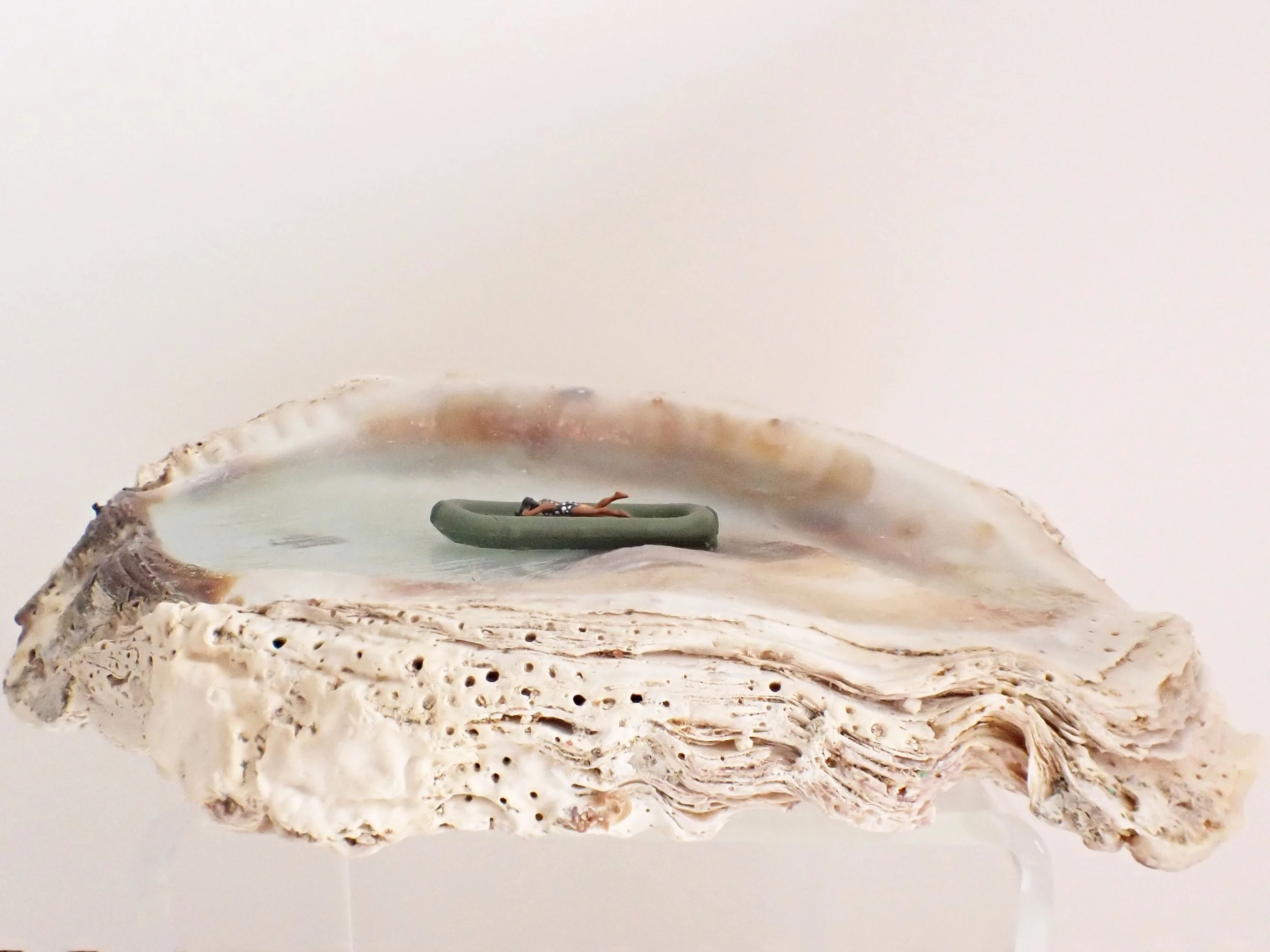 Becky-Wareing-Steele_Seashell-Diorama_Woman-Laying-on-a-Green-Raft_1_web.jpg