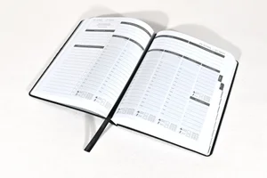MY PA 2027 Business Planner open on a weekly spread with ribbon marker