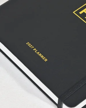 Close-up of the gold foil 2027 Planner lettering on the cover