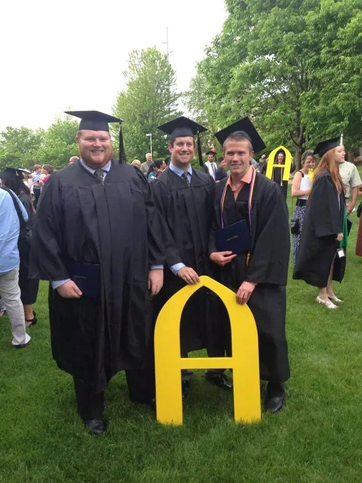 Pictured, my two cousins and a beached whale, graduating at 350 lb