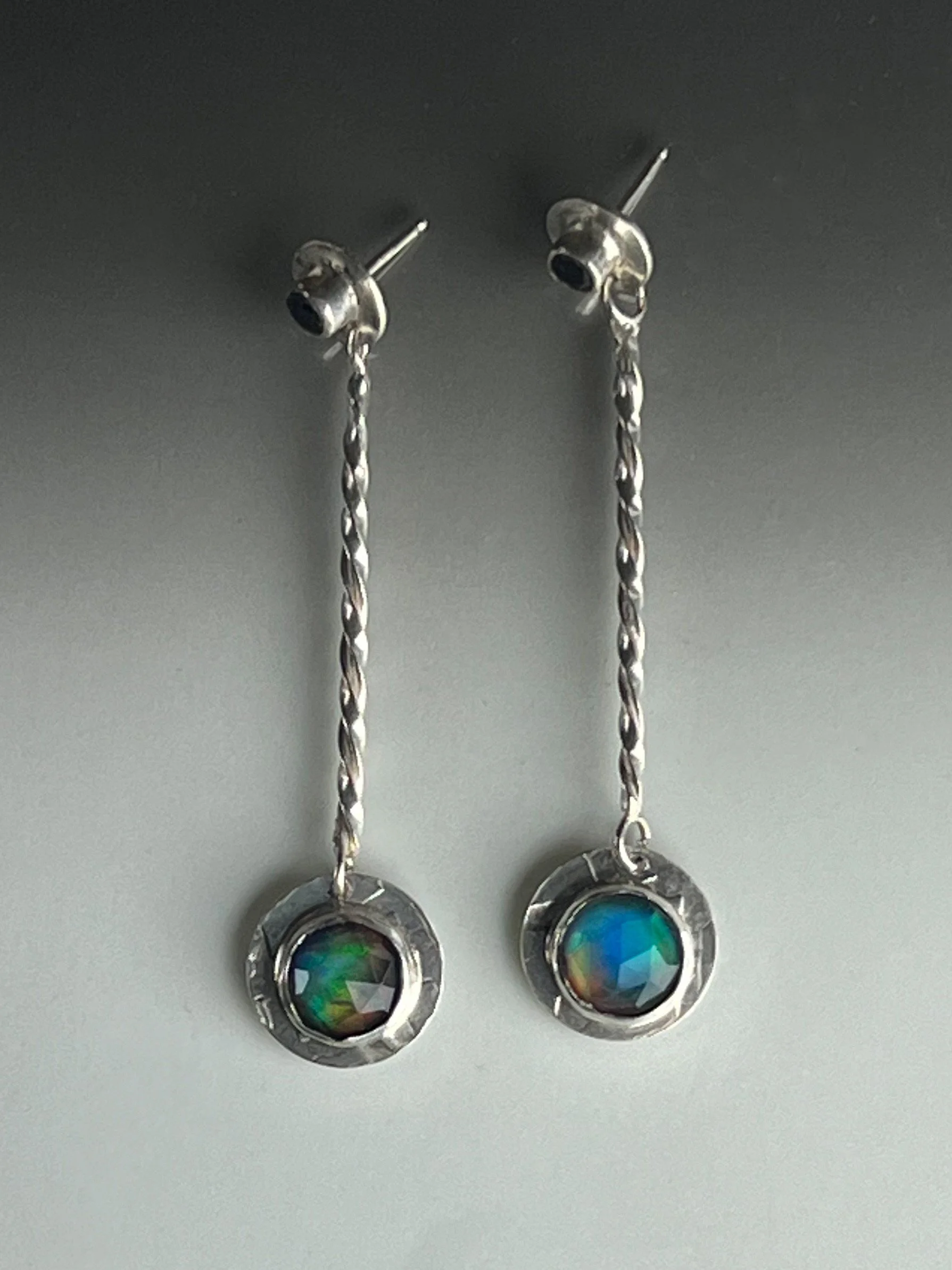Aurora opal doublets and blue sapphires