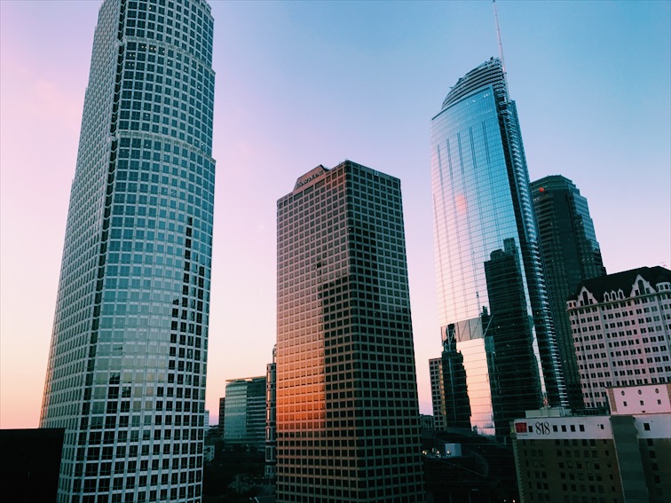 Watching the sunset reflecting off the buildings from the roof top of DOWNTOWN LECHE SALON
