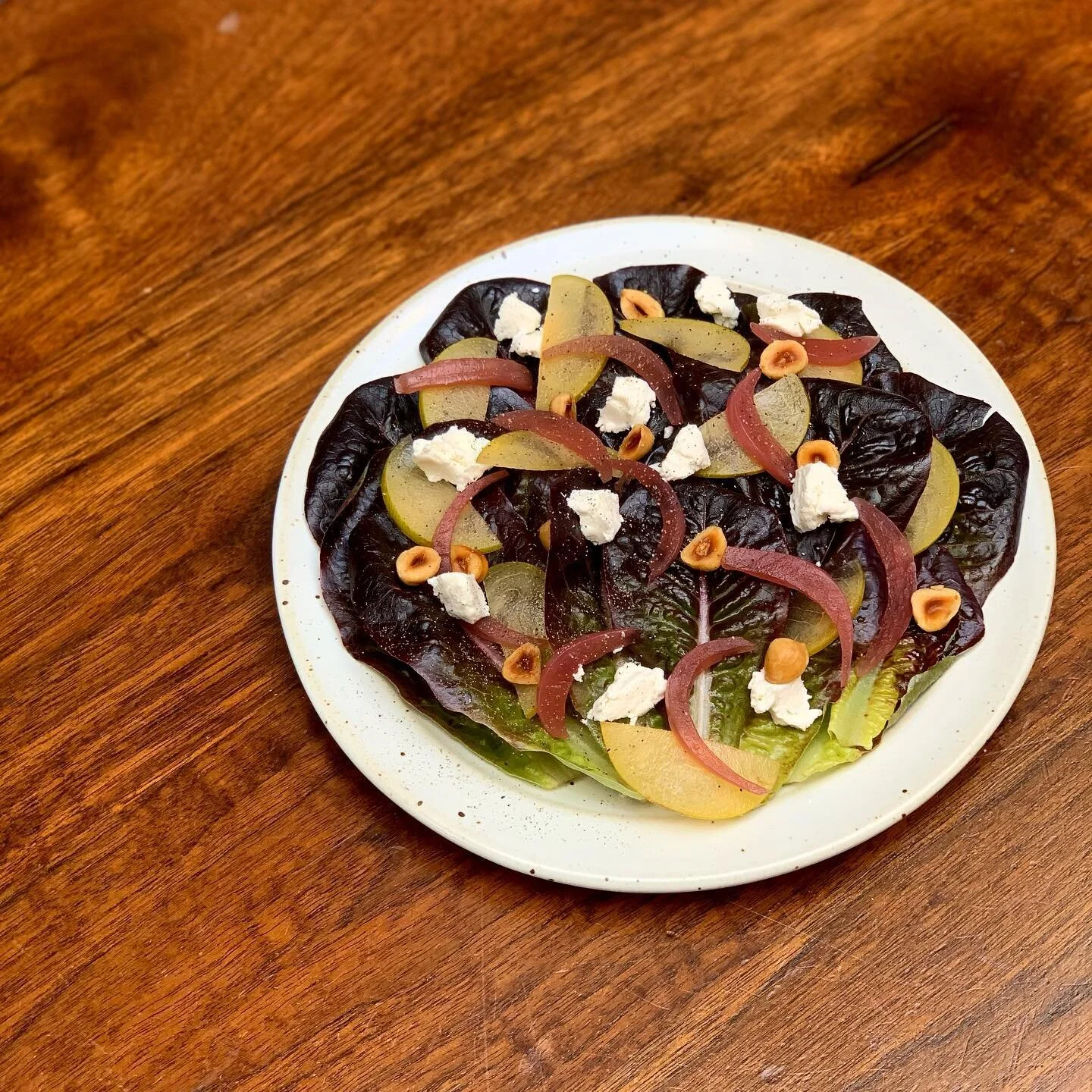 We&rsquo;re very excited to announce our new Plum Salad. We&rsquo;re getting beautiful plums from @kashiwasefarms that are so sweet. Going with some crispy lettuce from @fifthcrowfarm, hazelnuts, goat cheese, tons of black pepper &amp; pickled red onions we received from @tierra_vegetables. 

It&rsquo;s a bright salad that&rsquo;s a great starter to any meal!