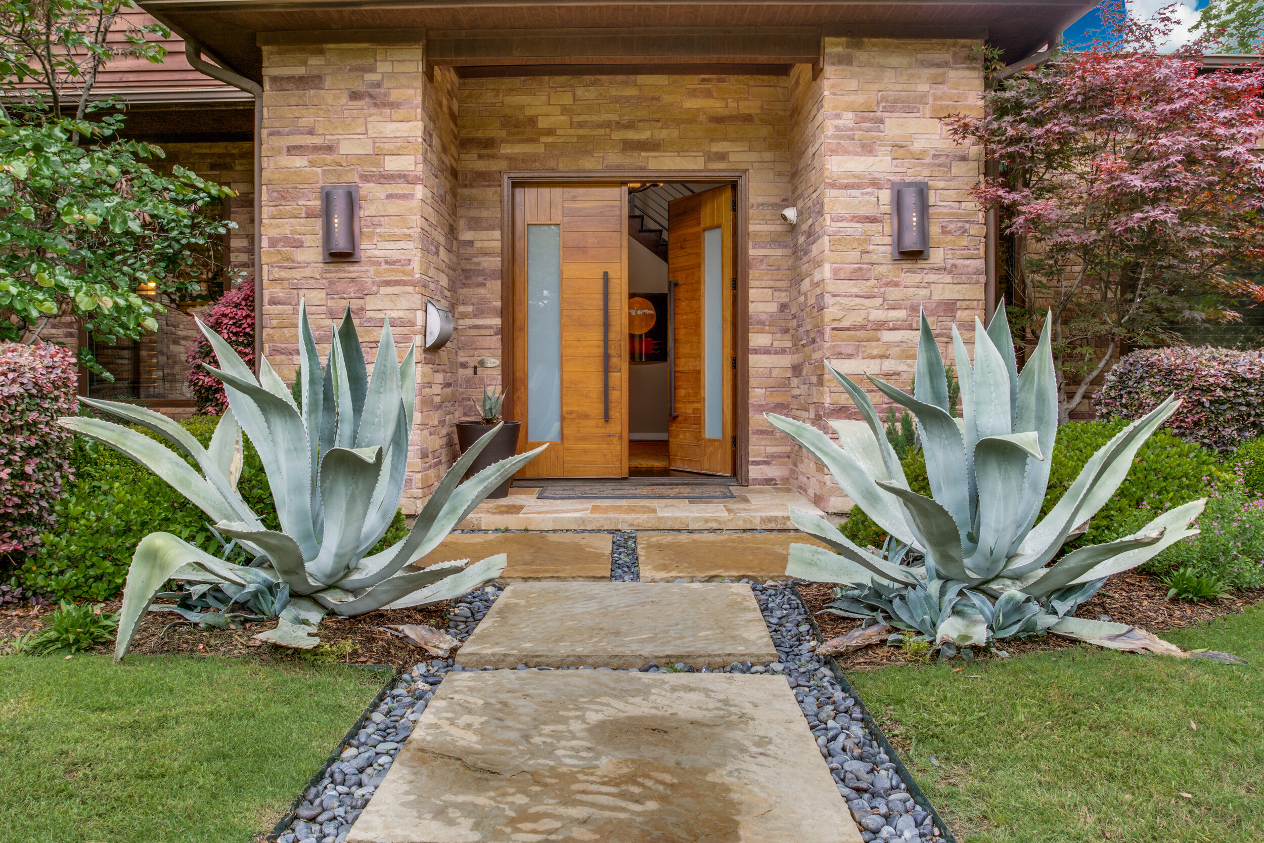 Giant Agaves Flank the Entry of this Preston Hollow Home