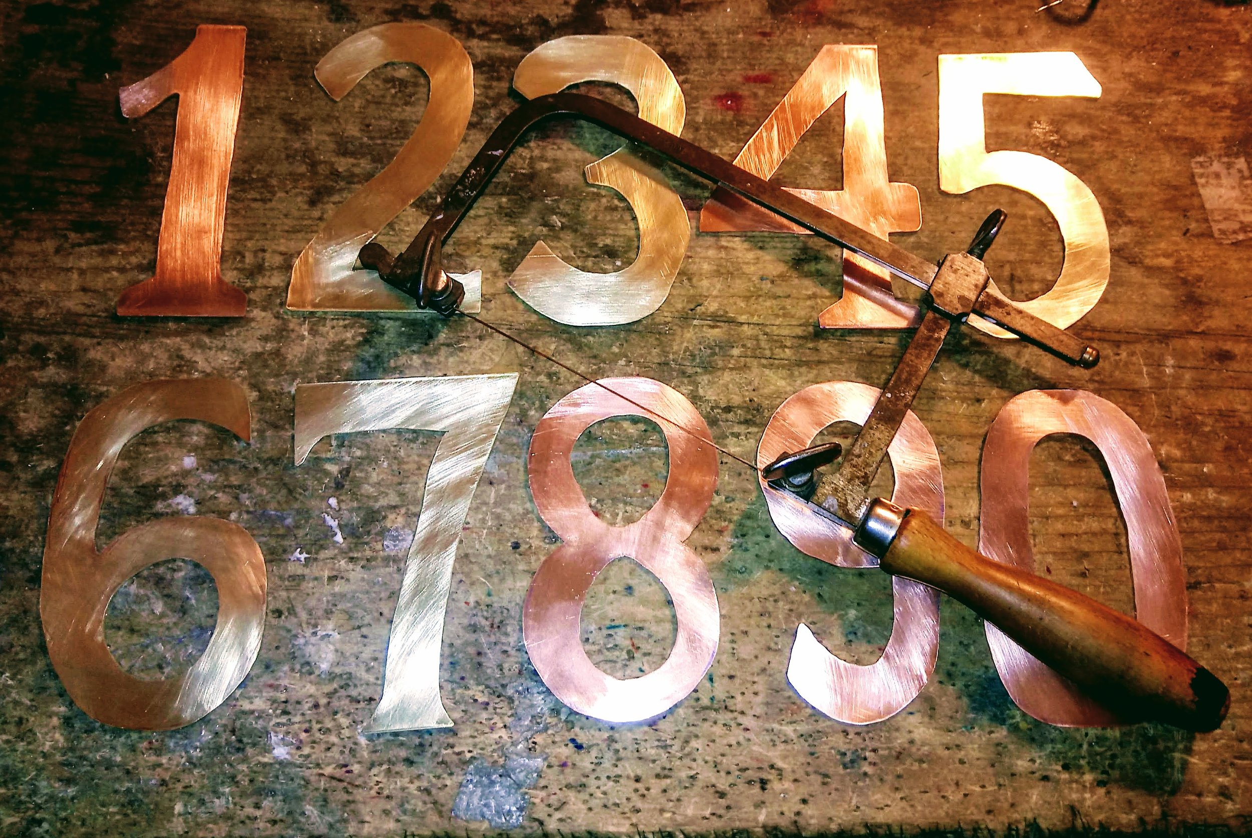 Hand-cut solid brass and copper numbers