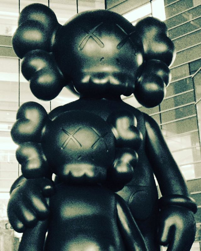 Post modern Mickey Mouse/deadmau5 sculpture &quot;Waiting&quot; by KAWS. I like it, but I like weird shit. #detroit #art #compuware #deadmau5 #mickeymouse #disney #creepy