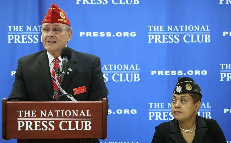 Charles Schmidt, National Commander of the American Legion, speaks to the media while flanked by Verna Jones, Executive Director of the American Legion in the District, during a news conference at the National Press Club on February 22, 2017 in Washington, DC. Schmidt spoke about critical veteran's issues facing the new Trump administration and Congress. The Legion has now called on Trump to reschedule cannabis for medical research to assist veterans. (Mark Wilson, Getty Images)