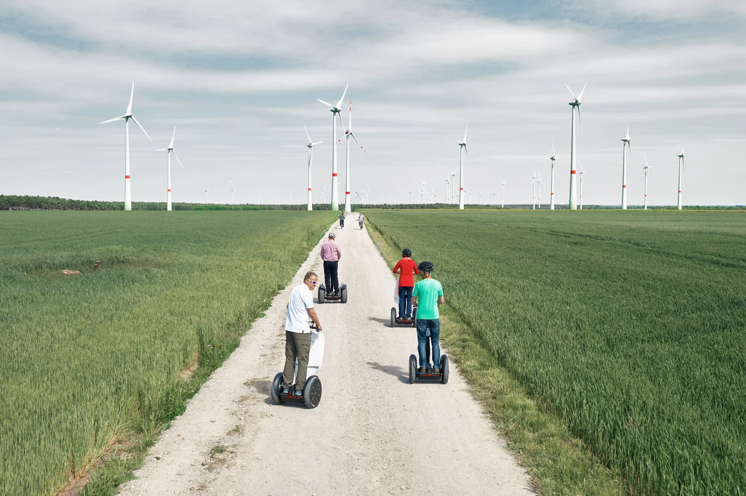 Feldheim Green Village
The village of Feldheim, located in the town of Treuinbrietzen in eastern Germany's state of Brandenburg, supplies power and heat for its 145 inhabitants with entirely local renewable resources. Electricity is produced by modern wind farms and a photovoltaic solar energy park built on a former military base. A next generation accumulator is planned for a next stage of development to help balance the fluctuating wind supply. Heat is made by a biogas plant fueled by wood chips.
Financing of the renewable energy for Feldheim came from a pooled effort by the local energy consumers, the municipality, the local utility and additional support by regional government and EU funds. The effort has paid off. The town has zero unemployment, compared to 30% unemployment in other villages in the area, with most residents working for the town's renewable energy sector. Feldheim cites energy security, a positive image, stable energy prices, and protecting future generations from environmental damage as other positives that they are gaining from their 100% renewable energy choices.