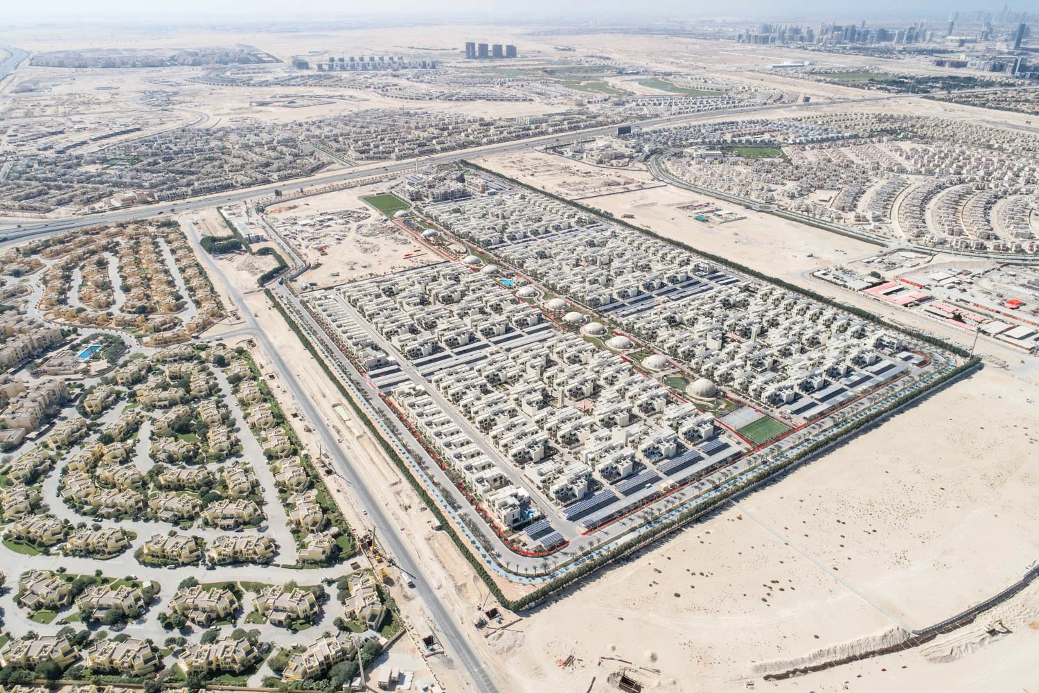 The Sustainable City, shown here, is the second mini green city and is located in the outskirts of Dubai. It is a 114acre development that has 500 solar powered villas, 11 natural greenhouses and an organic farm. It also produces more energy than it consumes. These homes were designed to give shade to each other, thus cutting air conditioning by 40%.
