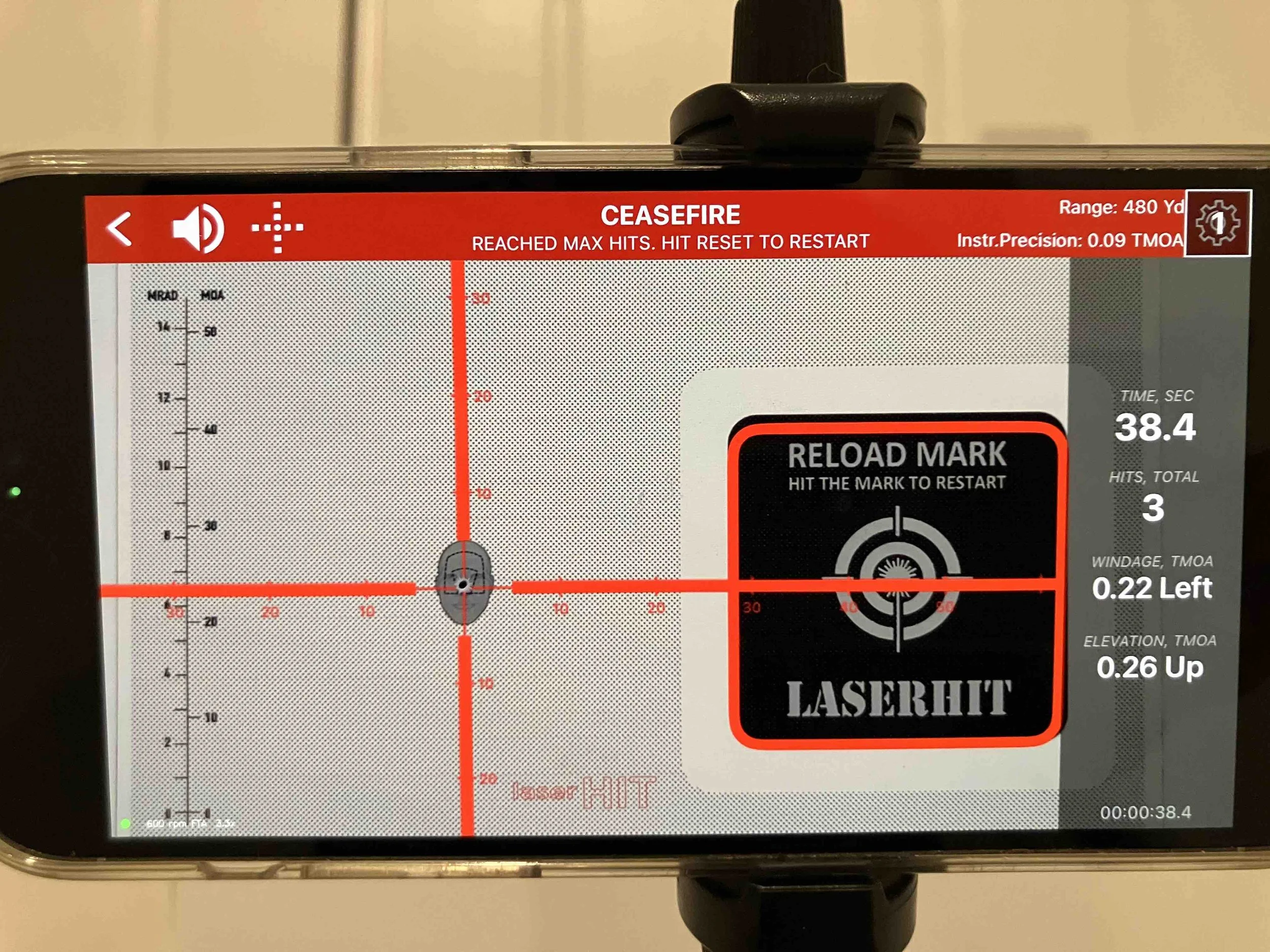 LaserHIT Custom Accuracy drill end stage showing crosshair target, reload mark, max offset results, and windage/elevation data