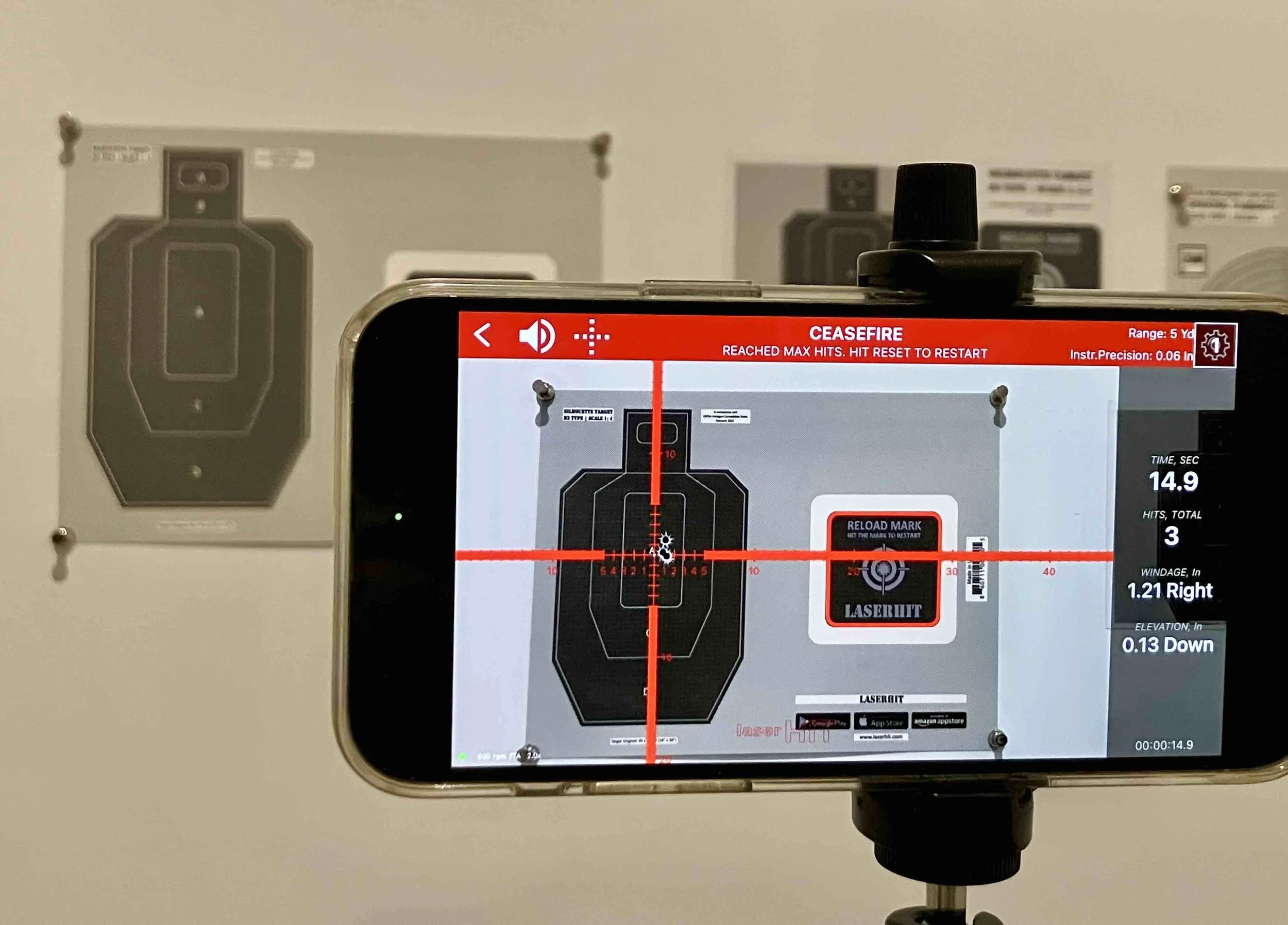 LaserHIT accuracy drill end-of-stage screen showing ceasefire status, shot placement, and measured windage and elevation offset results