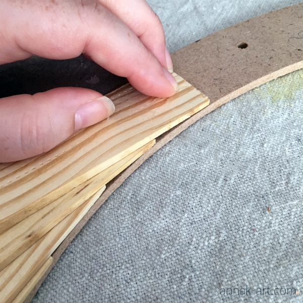 Align edges of shims with inner edge of wreath.