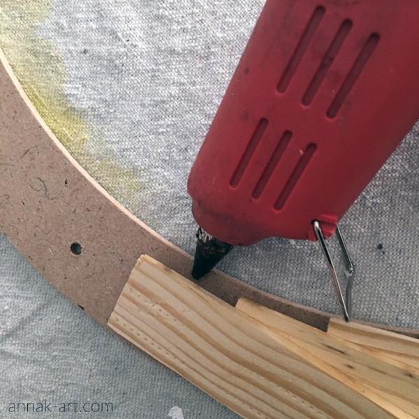 Tilt shims up to add glue under them. Please excuse my obviously well-used hot glue gun. :)