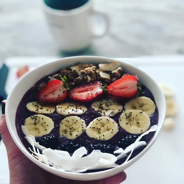 When you are hungry and thirsty...an #acaibowl does the trick! I added frozen berries, a&ccedil;a&iacute; powder, one banana and some almond butter for a little extra creaminess. Blended on high with 1/2 Cup coconut milk and topped with whatever I ha