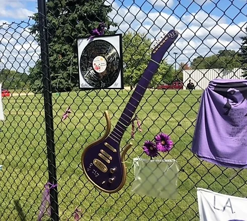 guitar on fence.JPG