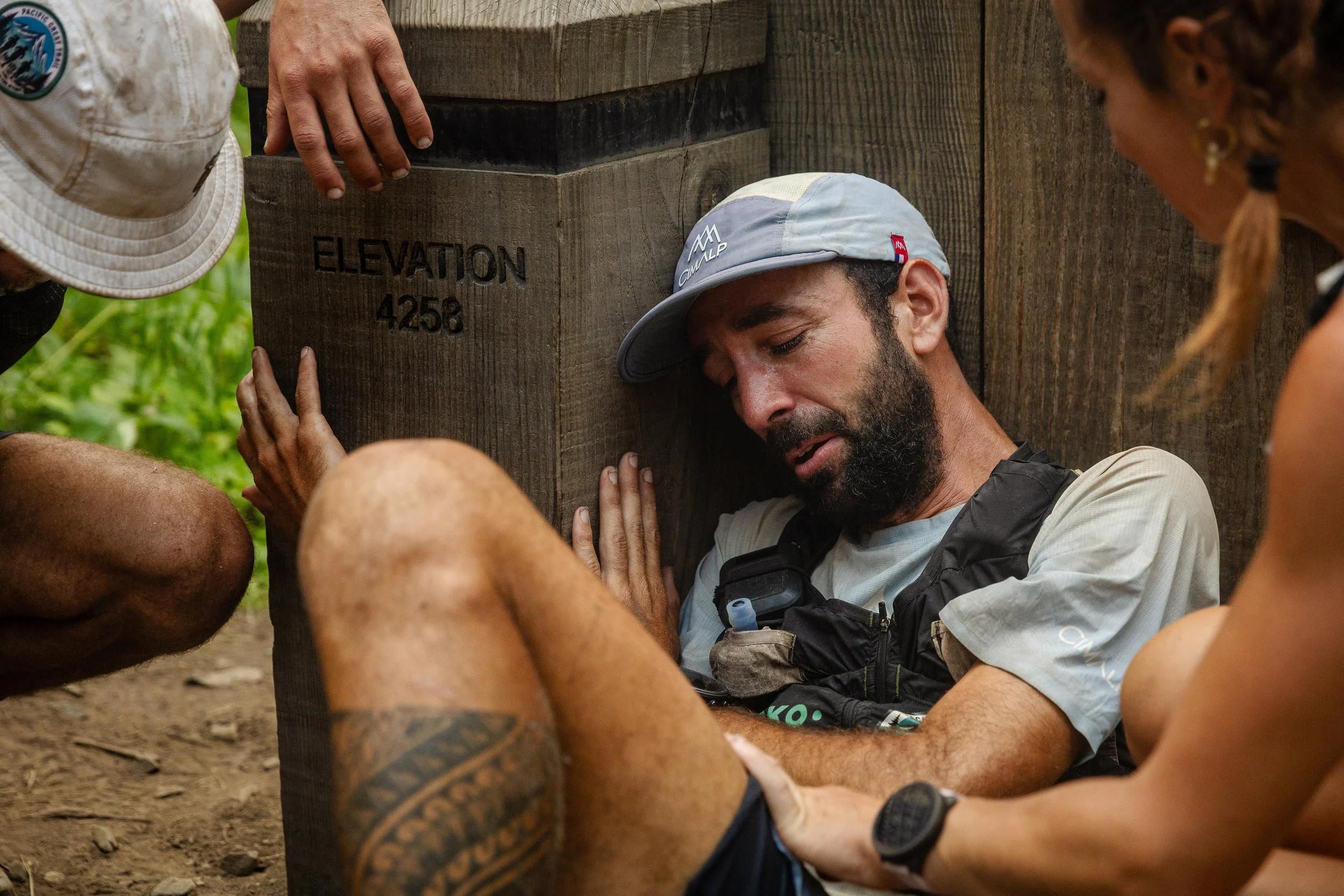Aurelien Sanchez sits at the northern terminus of the PCT after setting the new FKT for the trail