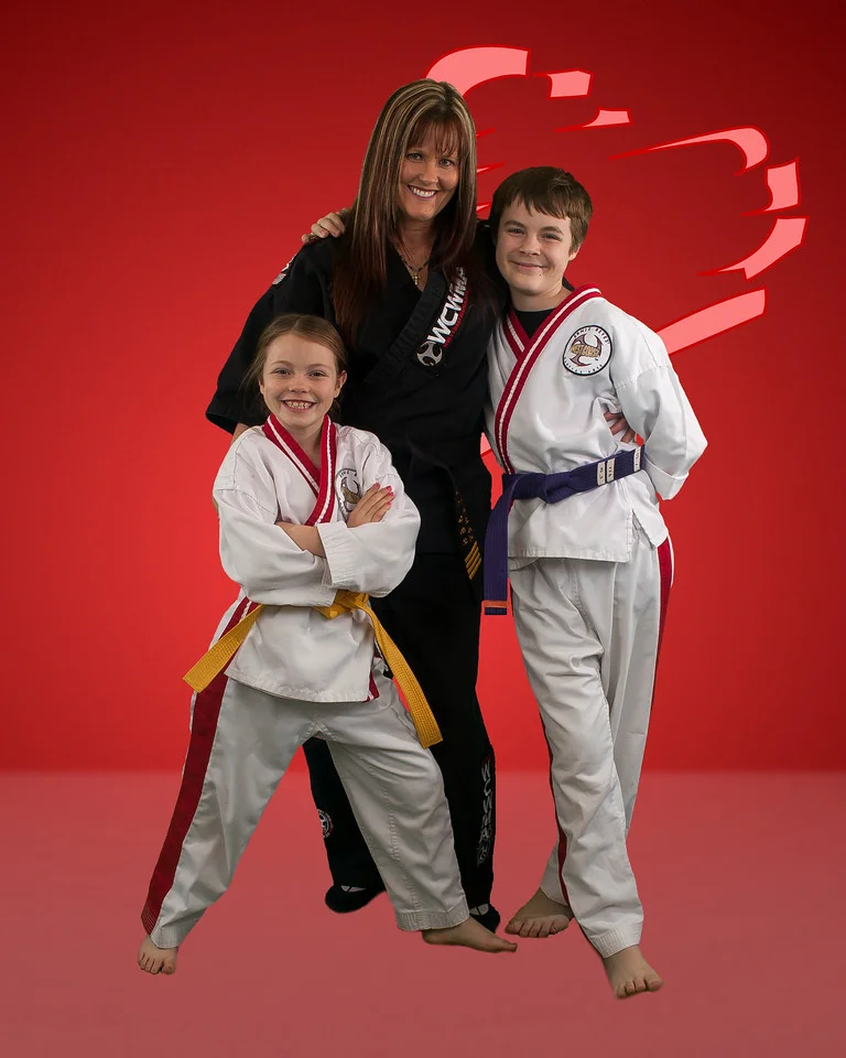 Denice with kids red heart background.jpg