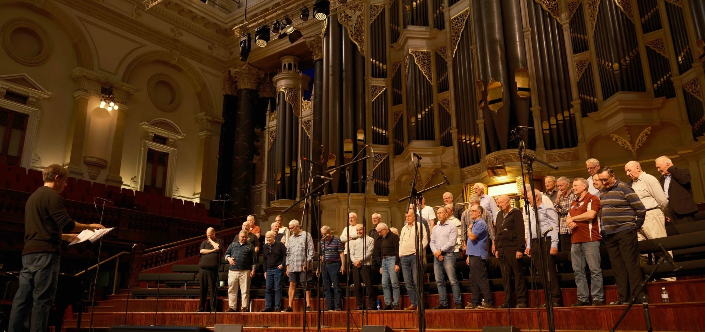 Image of Sydney Male Choir rehearsing at Sydney Town Hall