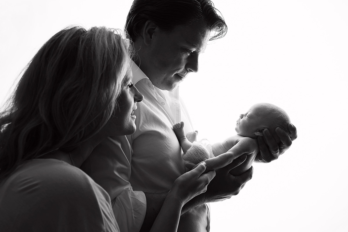 Celine Hare Newborn with mum and dad.jpg