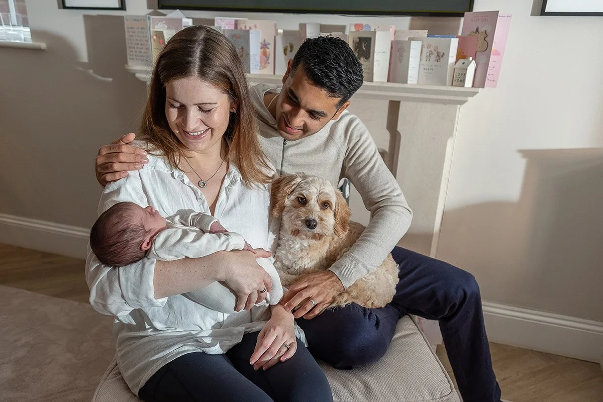 Family with newborn baby and the OG fur baby