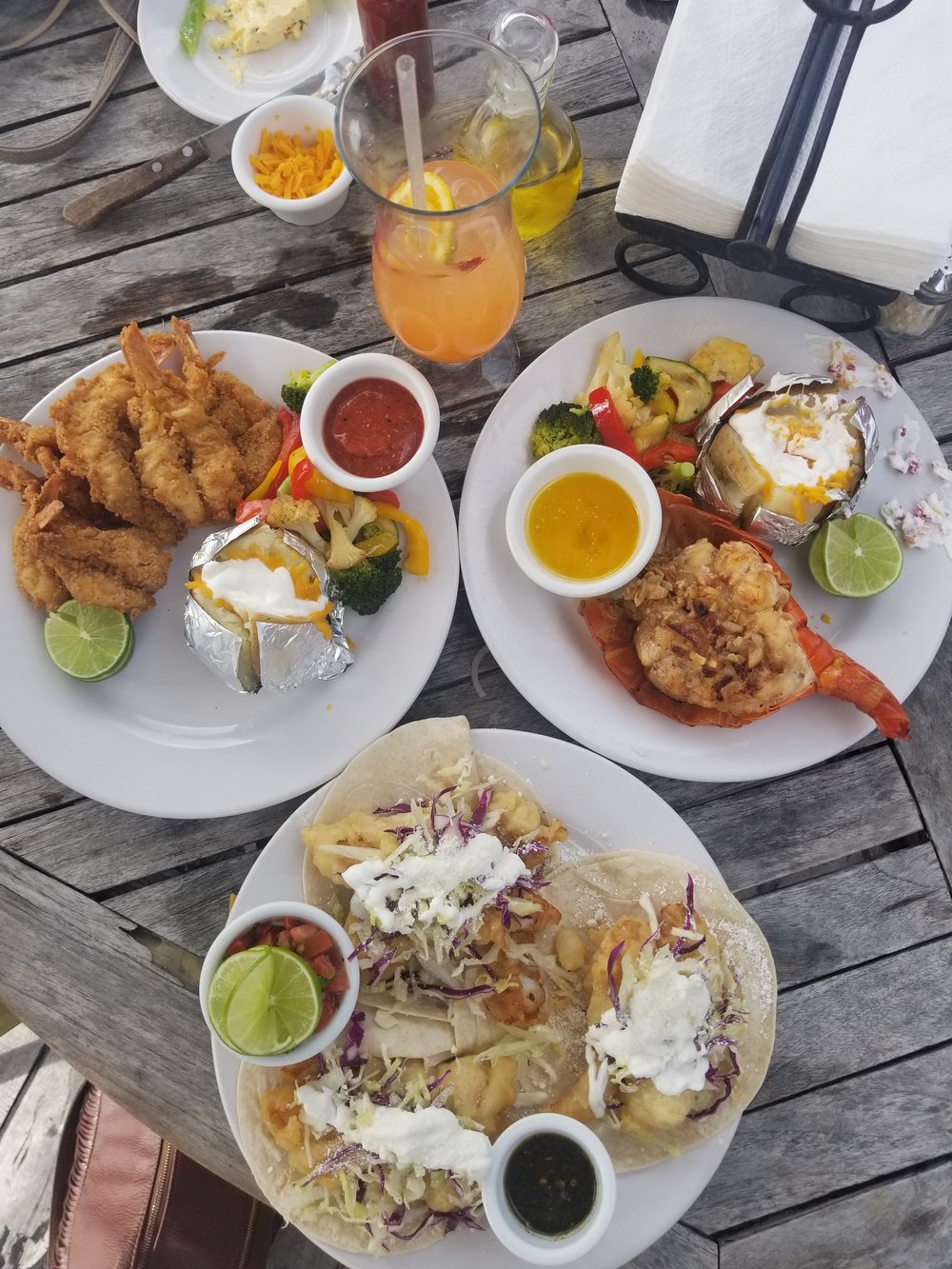 Photo Taken By Me : One of my favorite meals in Cancun. Brittany and I decided to share a few plates. We had fish tacos, lobster tail and fried shrimp. 