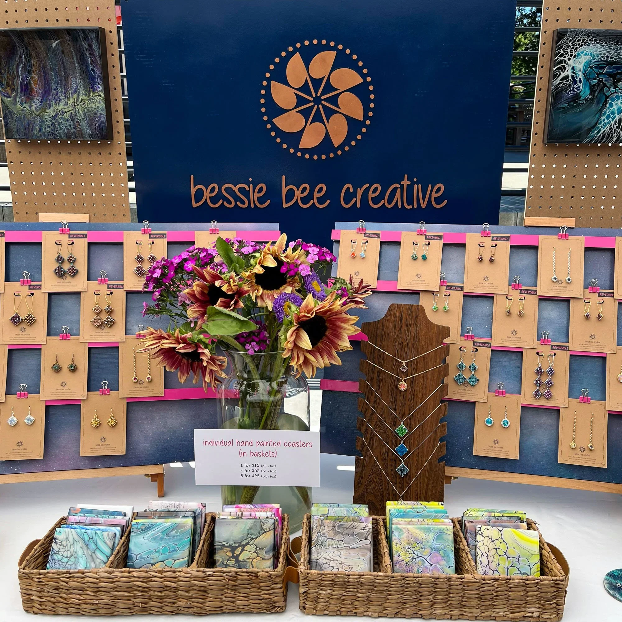 booth display, hand painted coasters, beaded earrings, beaded pendants on chain