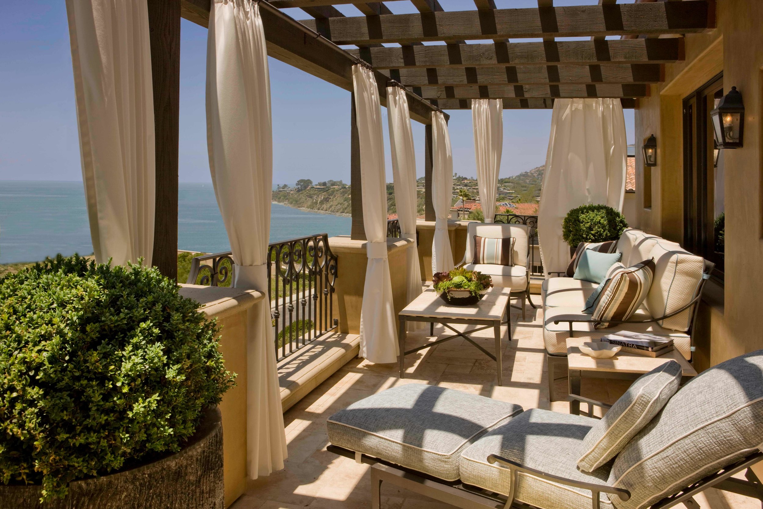 elizabeth-tapper-interiors-ritz-cove-laguna-exterior-outdoor-lounge-oceanfront-deck-view-draped-pergola.jpg