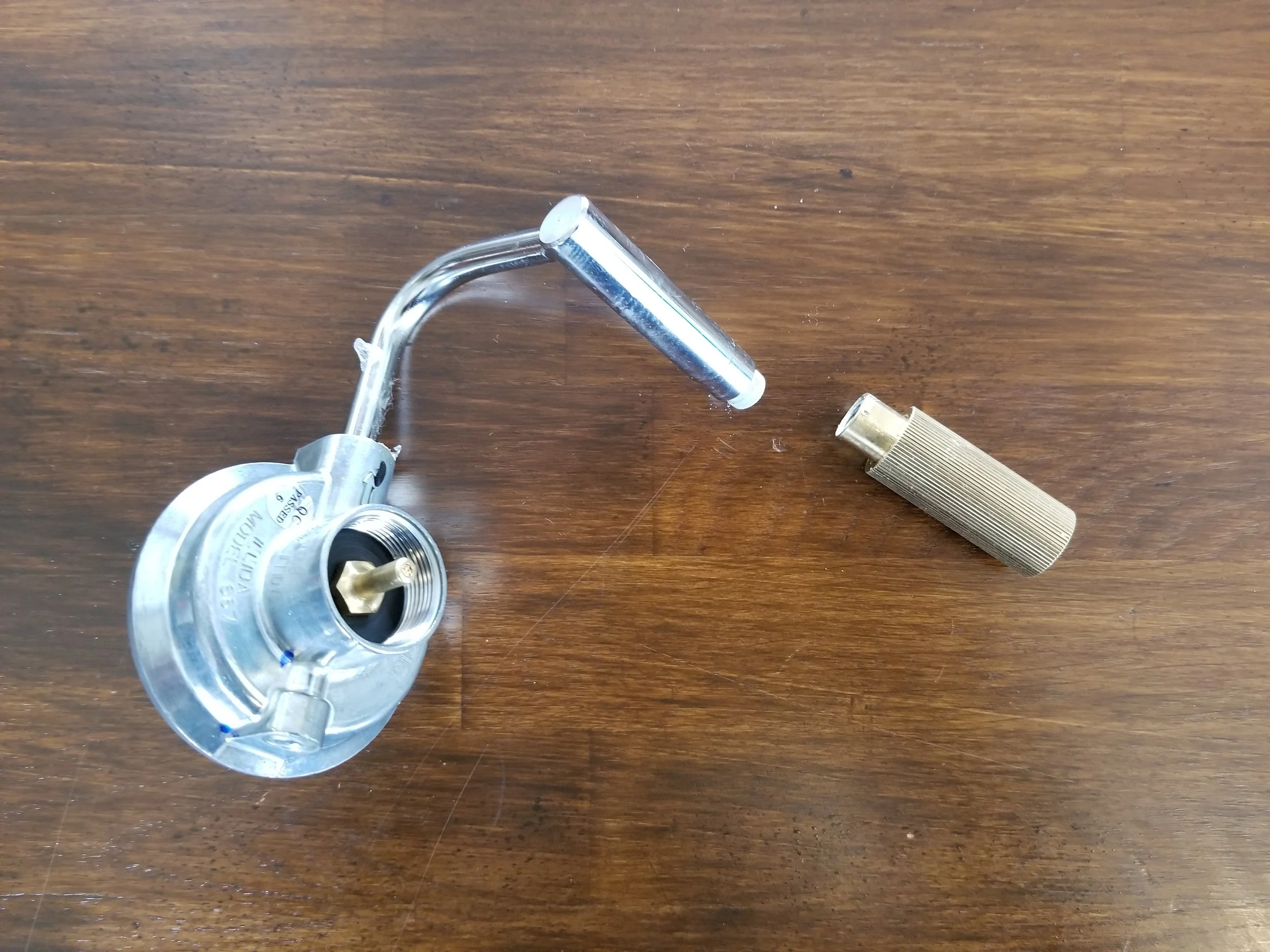 Be very careful not to damage the brass fitting when removing with a wrench. Use a piece of rag or rubber from an old bike tube to protect the fitting from the wrench teeth.