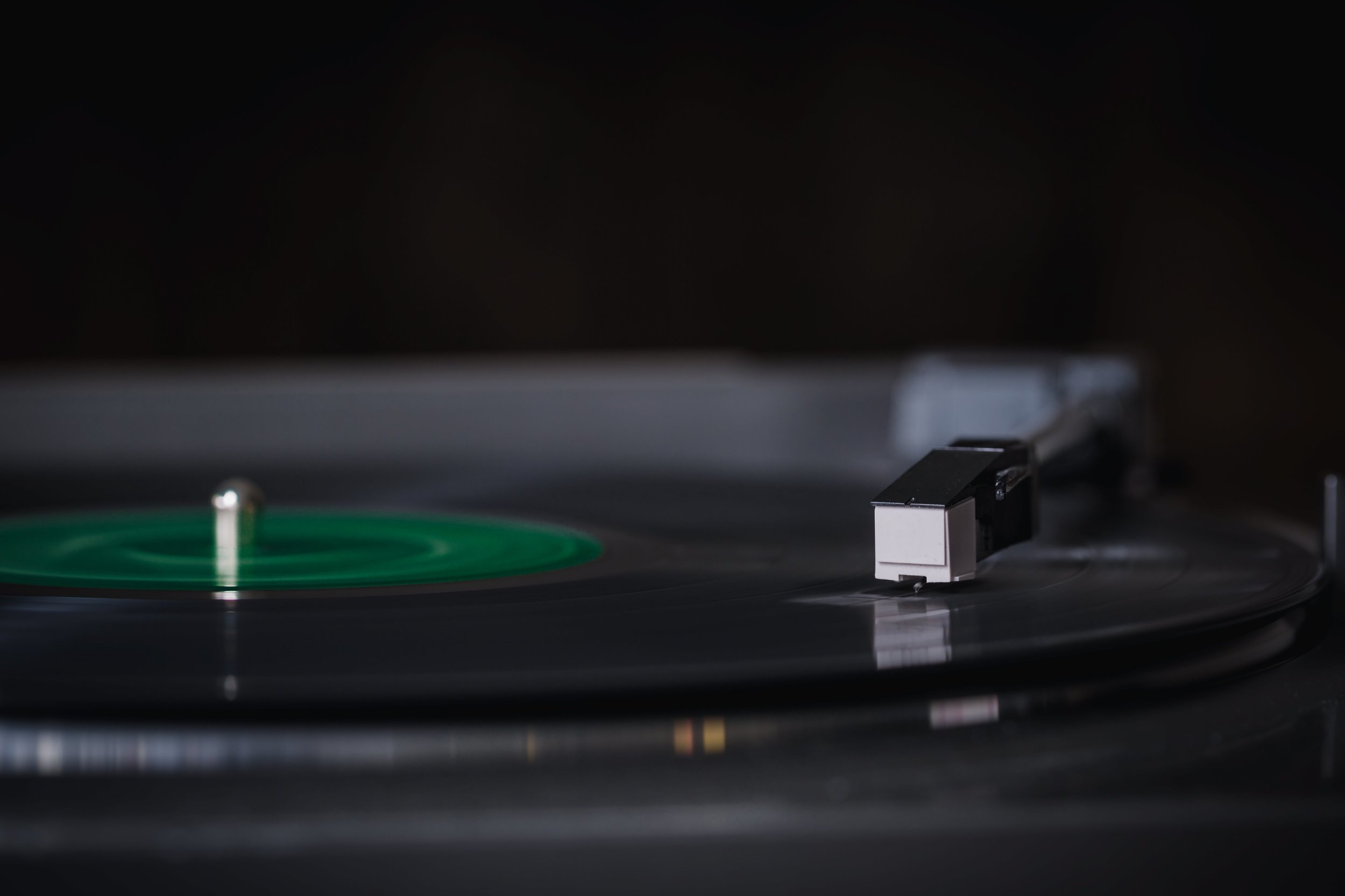 Old vinyl records spins on record player