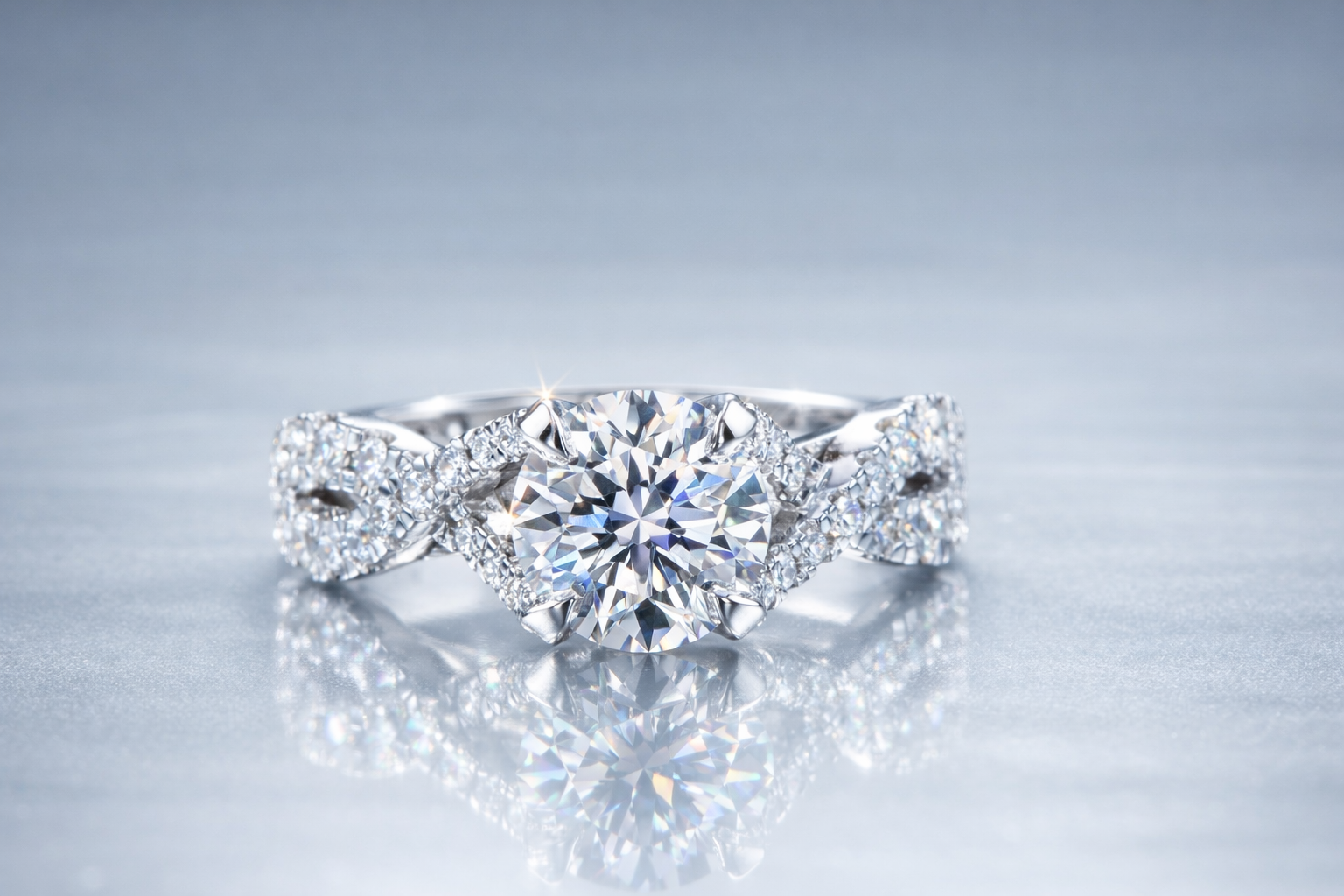 Round brilliant crossover pave engagement ring in platinum.png