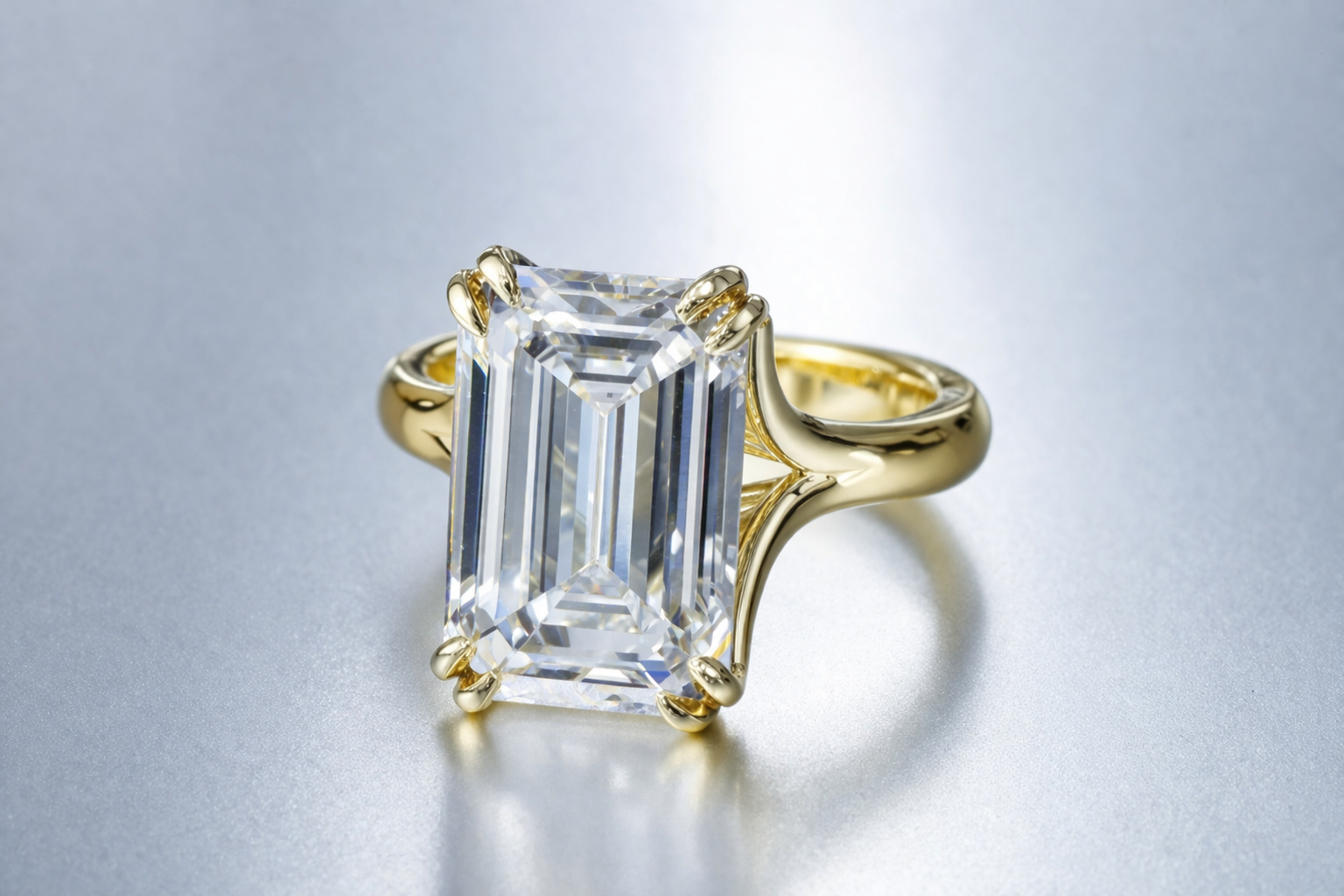 Emerald cut 8 carat lab diamond solitaire engagement ring in 18K yellow gold.png