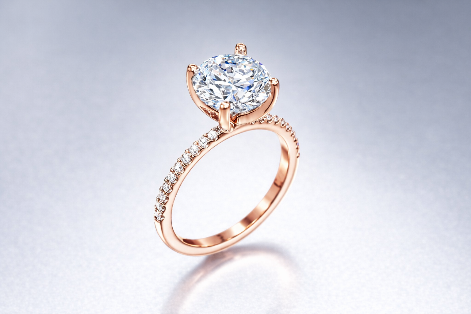 18K Rose Gold Solitaire with round center stone and diamond pave band