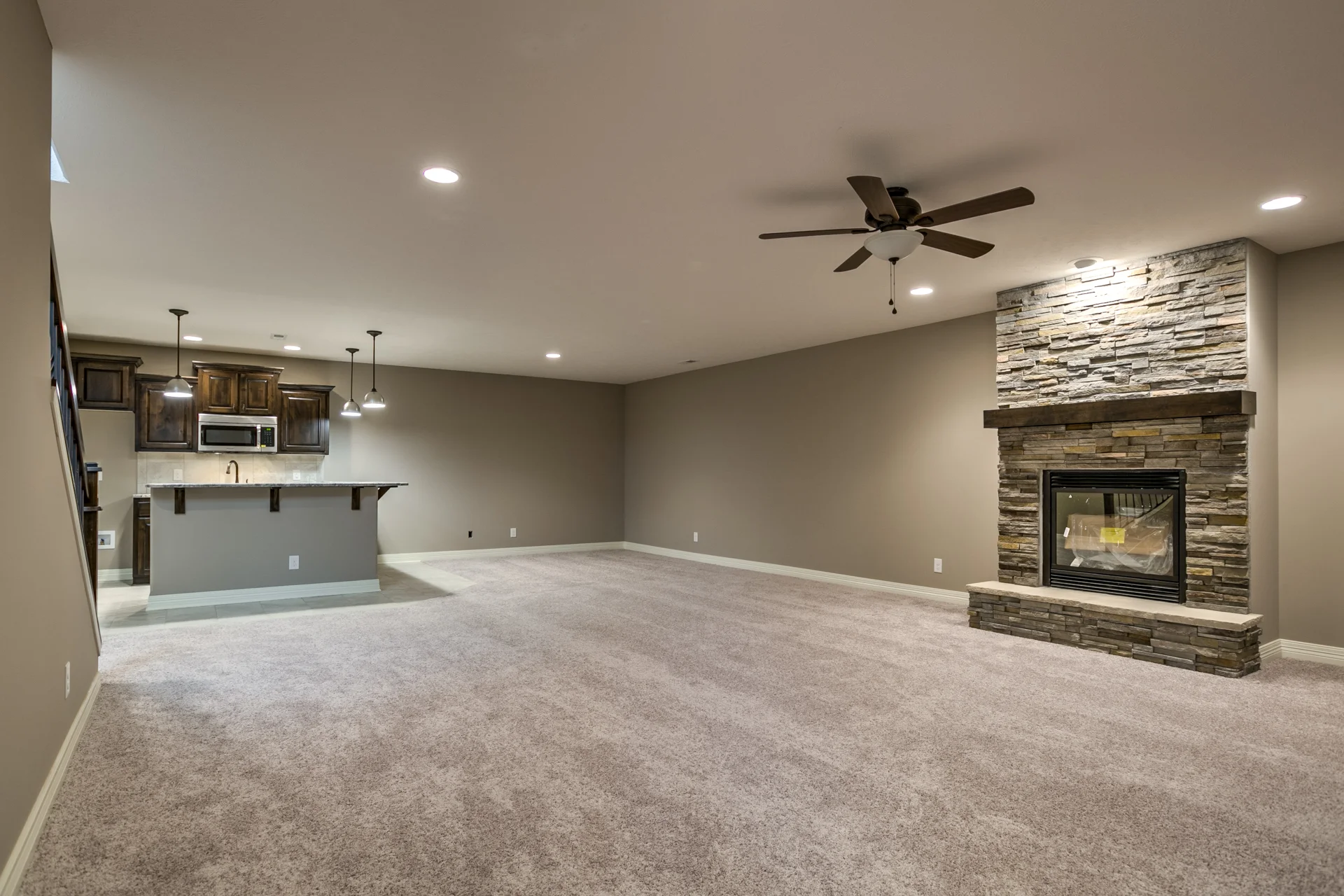 Basement with bar and fireplace