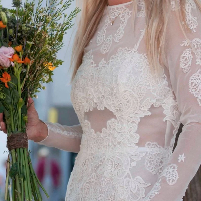  different styles of guipure lace are embroidered onto silk georgette  wedding dress to create a modern and geometric look 