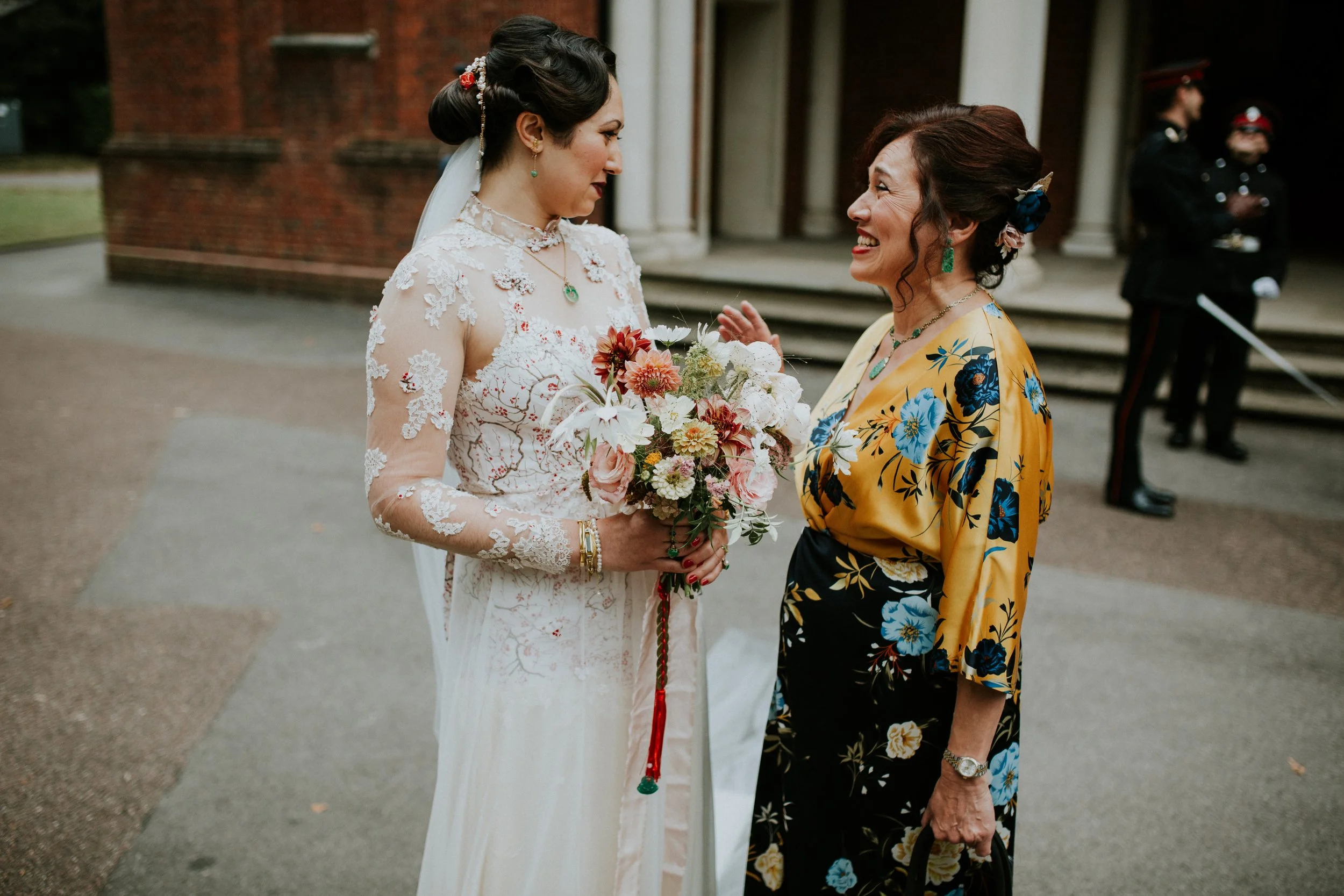  A bride wears an ivory bridal cheongsam made from the screen printed silk of her mothers own wedding dress. 