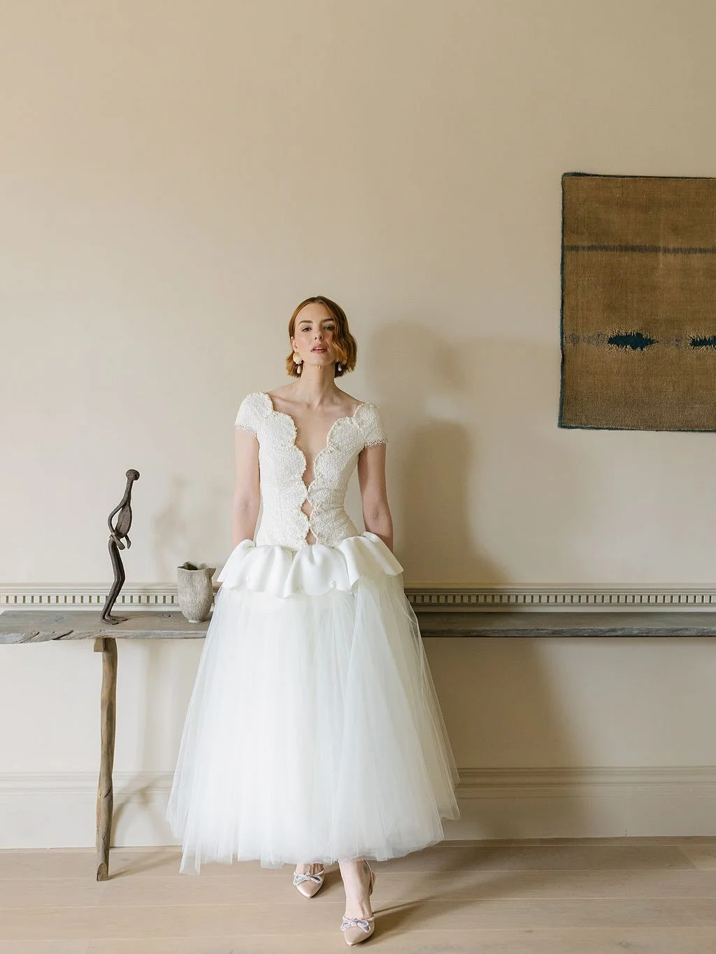 Vintage bridal is back!

A decade ago, vintage meant reproduction: borrowed eras, contemporary lace, echoes of the past.

In 2026, it is about reinterpretation. Heritage in a modern silhouette.

Scalloped necklines, corseted bodices, and tulle skirts