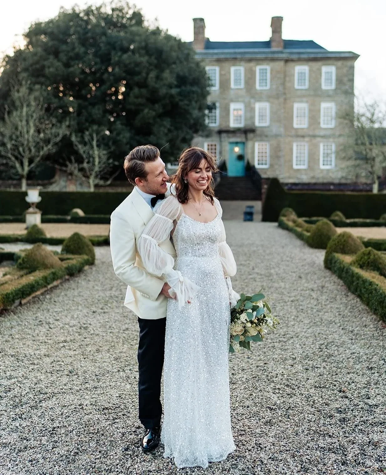 A beautifully sparkling wedding gown for a New Years Eve wedding at Kingston Estate

A simple, chic silhouette  with. a perfectly shaped scoop neckline leading into pointed wings. The fabric is the showstopper. A tulle embellished with glass beads an