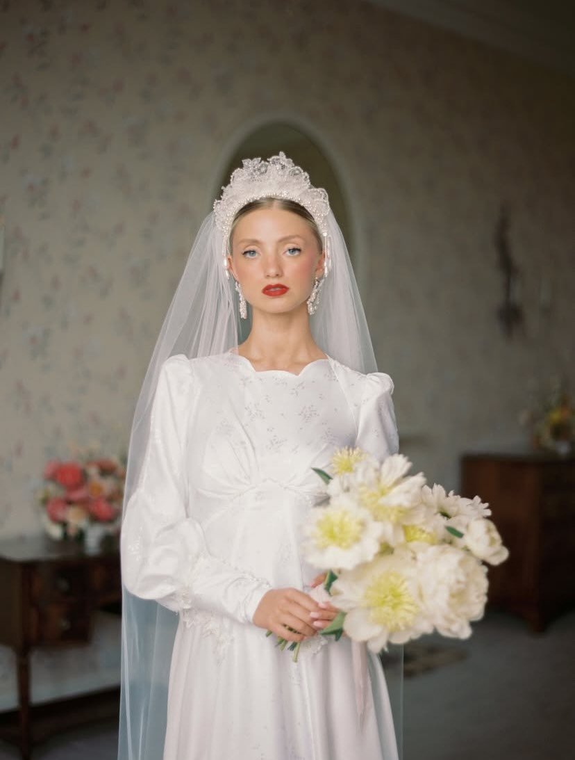 Spring, come do your thing!

Fresh white silky jacquard with a vintage twist, blouson sleeves and a scalloped neckline.

Photo by @katiejulia_ 
Florals @breige__ 
Planning @inawe_weddings 
Hair @hair_by_duboux 
Makeup @jessicarose.makeupartist 
Venue