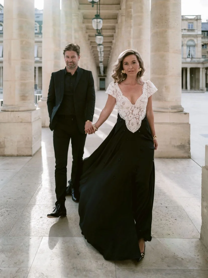 For Katie Julia&rsquo;s engagement in Paris, we created a bespoke monochrome dress designed to feel both timeless and striking. The silhouette moves with effortless drama, a flowing black skirt that sweeps through the colonnades of Paris, paired with